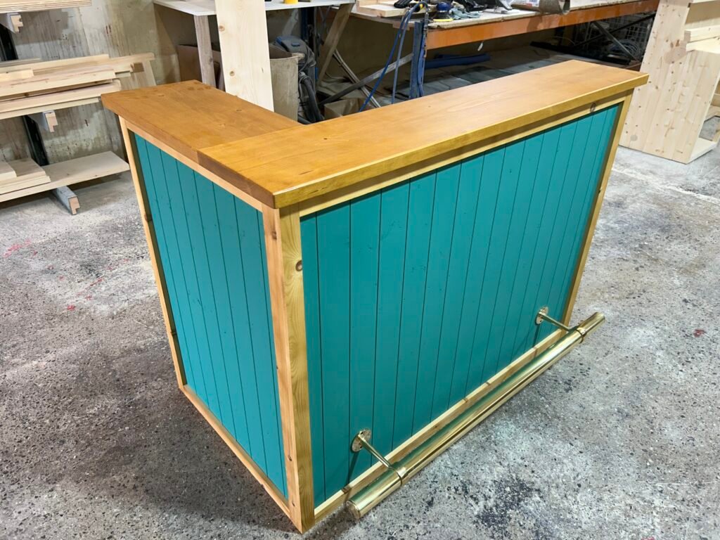 Vibrant corner entertaining with Vintage Satin Edge Teal Martini 140x80 L-shape home bar and foot rail